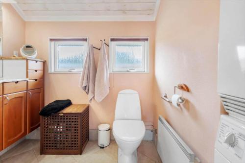 a bathroom with a toilet and a sink at 30193-Odder-Thorasvej-79 in Odder