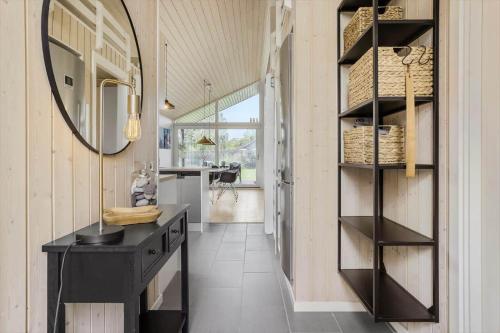 a kitchen with a black counter and a mirror at 30178-Odder-Chr-Christensensvej-9 in Beder