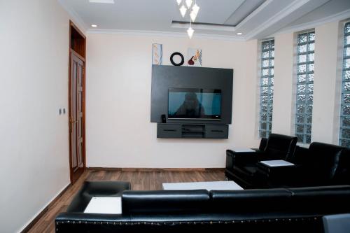 TV a/nebo společenská místnost v ubytování The Moon Apartments