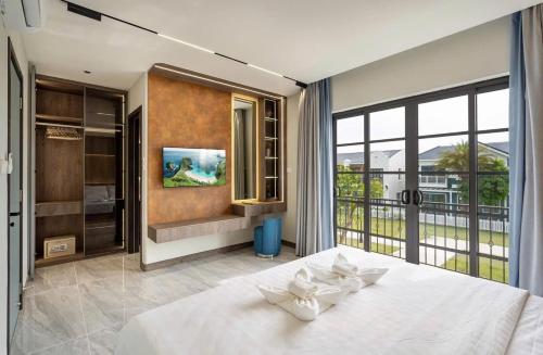 Ένα ή περισσότερα κρεβάτια σε δωμάτιο στο Villa NovaWorld Phan Thiết - 86Home - Biệt thự 4 phòng ngủ - No13334