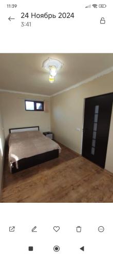 a bedroom with a bed and a window at Dav Home in Vanadzor