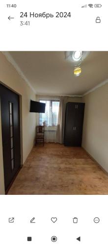 an empty room with a door and a room with a window at Dav Home in Vanadzor