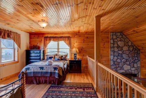 a bedroom with a bed in a log cabin at New River Ramble in Todd