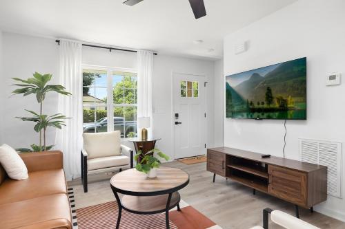a living room with a couch and a table at Stylish Queen City Getaway in Camp North End in Charlotte