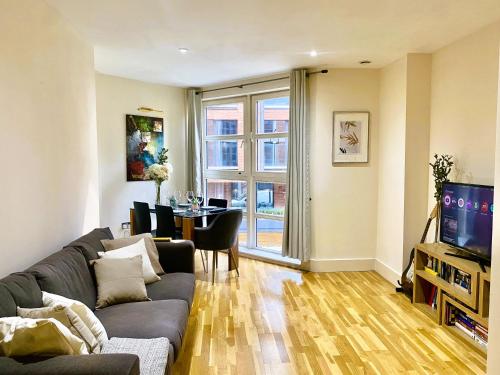 a living room with a couch and a table at Central London Flat ideal for Shopping and Big Ben in London
