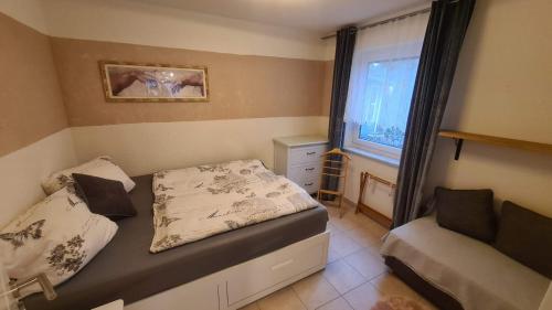 Ένα ή περισσότερα κρεβάτια σε δωμάτιο στο Ferienwohnung Stadler