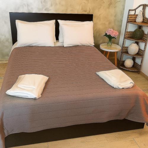 a large bed with two pillows on top of it at Elafonisi Villa above the Beach in Elafonisi