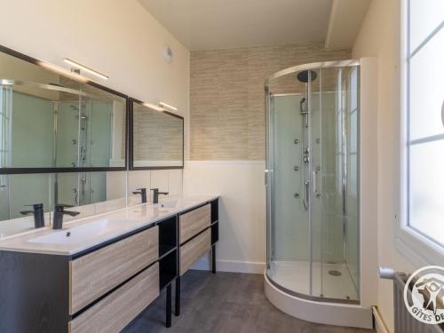 a bathroom with two sinks and a shower at Gîte familial pour 8 pers. à Saint Aubin de Luigné - FR-1-622-117 in Saint-Aubin-de-Luigné