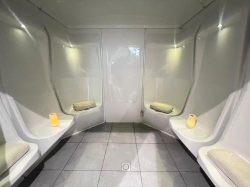 a small bathroom with two toilets in an airplane at Lagrange Apart'Hotel l’Escale Marine in La Rochelle