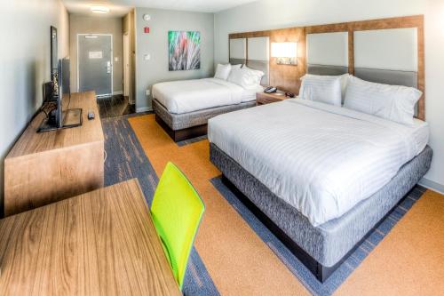 a hotel room with two beds and a television at Holiday Inn Express & Suites Cleveland/Westlake, an IHG Hotel in Westlake
