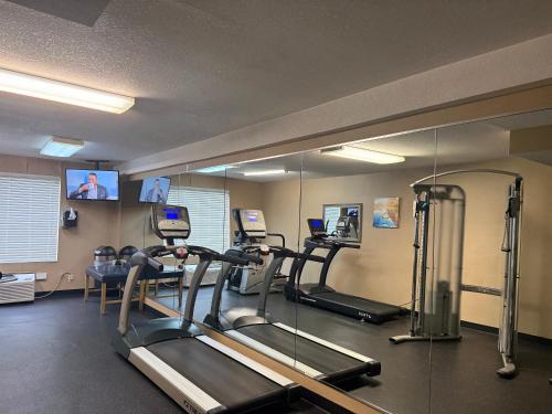 a gym with treadles and a mirror in a room at Comfort Inn Falls Church - Tysons Corner in Falls Church