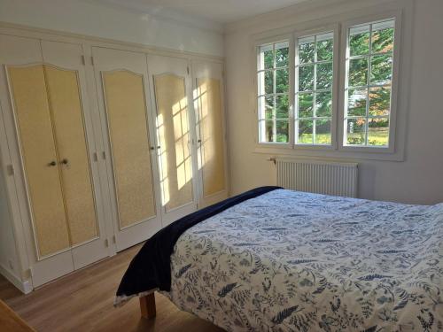 Postel nebo postele na pokoji v ubytování Les Camelias