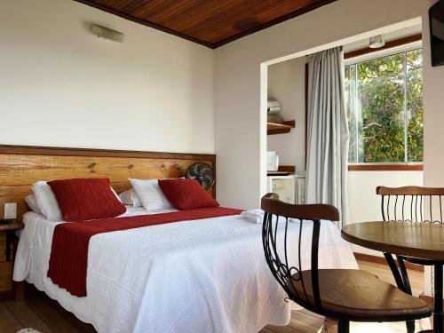 Postel nebo postele na pokoji v ubytování Pousada Vista de Lavras