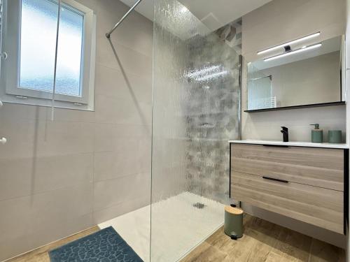 a bathroom with a glass shower and a sink at Karrika buria in Saint-Martin-dʼArberoue