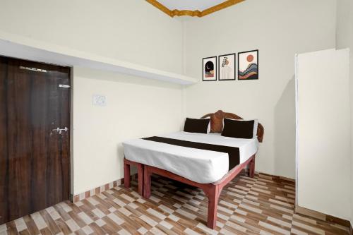 Ένα ή περισσότερα κρεβάτια σε δωμάτιο στο Hotel O Hamar Mitan