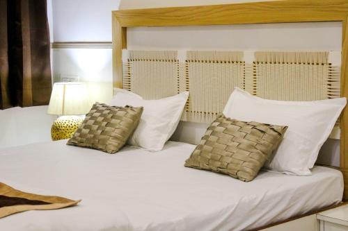 Postel nebo postele na pokoji v ubytování Shree kailasham