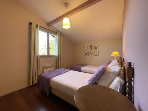 En eller flere senge i et værelse på Mendia