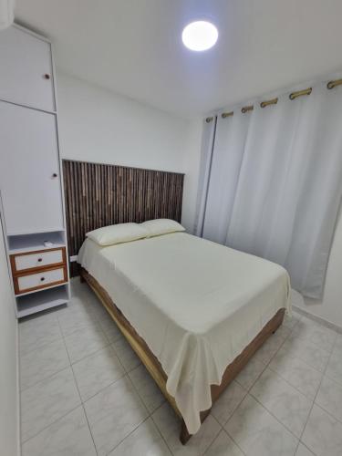 a bedroom with a bed and a dresser in it at Casa Narad Valledupar in Valledupar