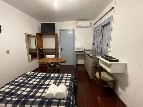 Postel nebo postele na pokoji v ubytování kitnet xixo 03