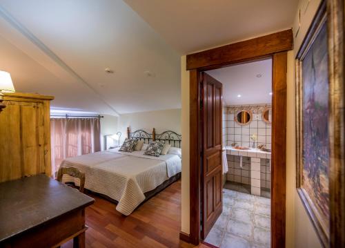 Posteľ alebo postele v izbe v ubytovaní Hotel Alda Vía León