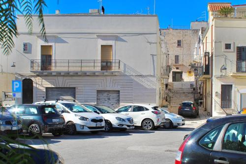 a group of cars parked in a parking lot at Terratetto - Apulia in Ceglie Messapica