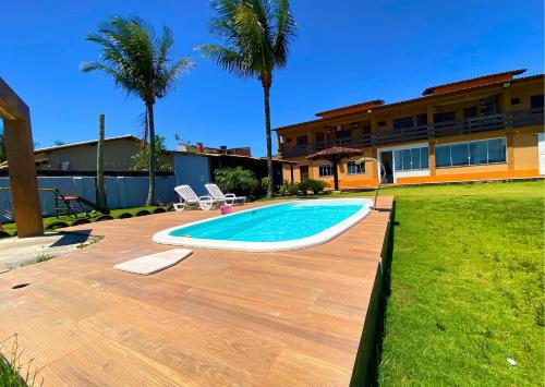 Bazén v ubytování Casa FRENTE MAR Anchieta c/piscina e Área Goumert nebo v jeho okolí