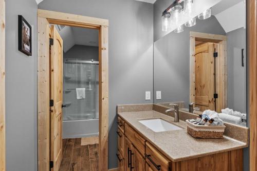 a bathroom with a sink and a shower at Bear Necessities in Beech Mountain