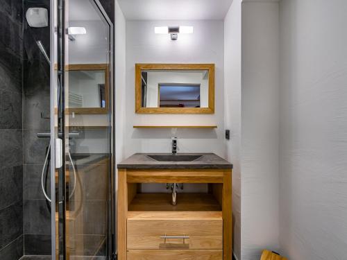 a bathroom with a sink and a shower at Chalet moderne avec parking et wifi, à proximité des pistes et commerces - FR-1-566-20 in Les Allues