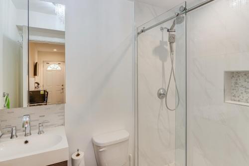 a bathroom with a shower and a toilet and a sink at Work and Play! North Hills Studio 15 Mi to Hollywood in North Hills