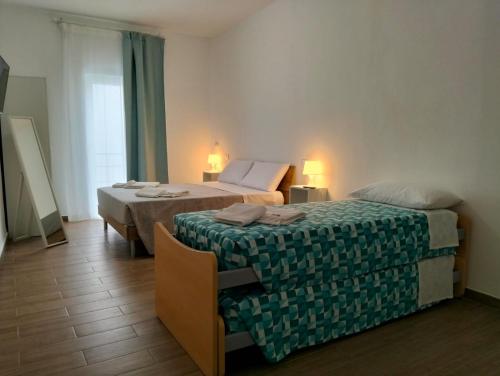 Ένα ή περισσότερα κρεβάτια σε δωμάτιο στο D&Dhome