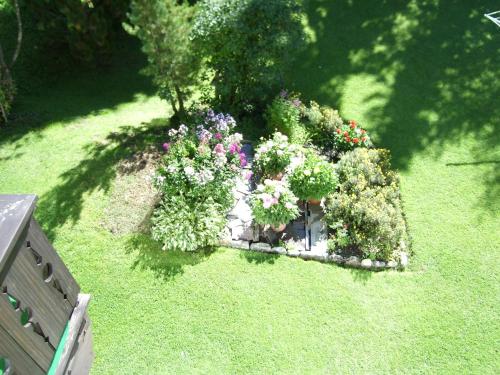 an overhead view of a garden with flowers and plants at Appartements Birkenhof in Berwang