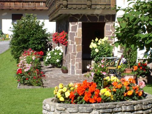 a bunch of flowers in a flower garden at Appartements Birkenhof in Berwang