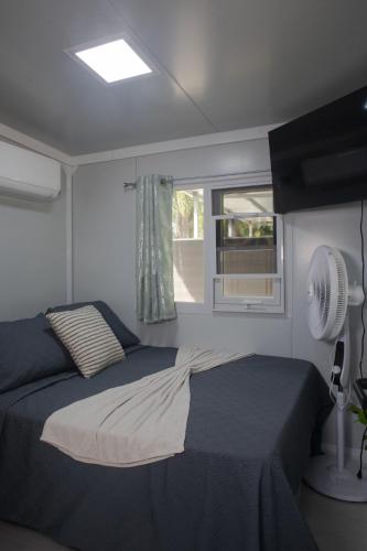 Llit o llits en una habitació de Coqui Tiny House - Unit 1