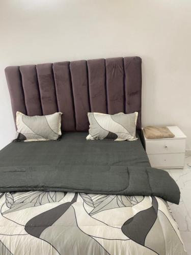 Ένα ή περισσότερα κρεβάτια σε δωμάτιο στο Bel appartement à Ngor