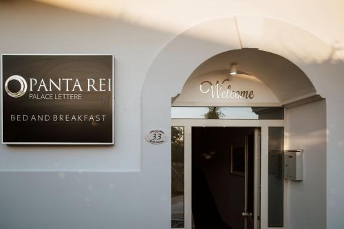 a sign above the door of a building at Pantarei Palace in Lettere
