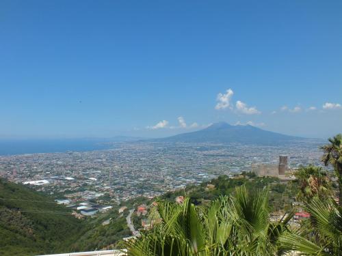 a view of a city with a mountain in the background at Pantarei Palace in Lettere