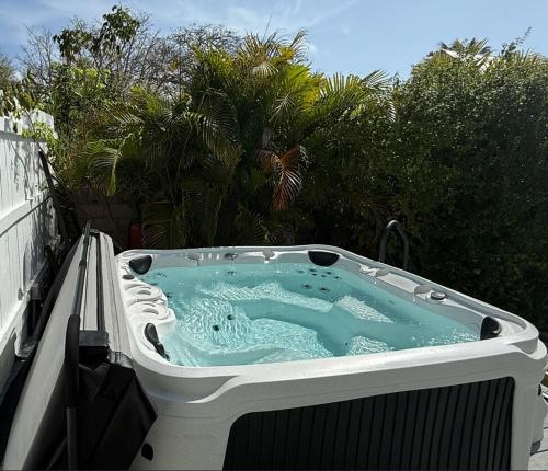a hot tub sitting on top of a balcony at Island Paradise in Key West