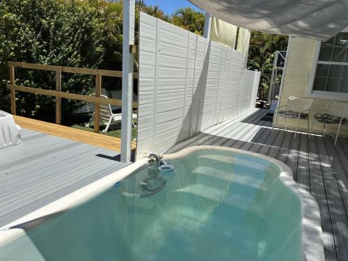 a small swimming pool on a wooden deck at Island Paradise in Key West