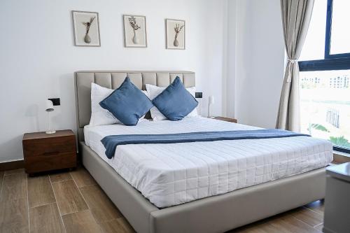 Ένα ή περισσότερα κρεβάτια σε δωμάτιο στο Central Park at Downtown Punta Cana