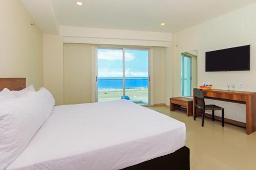 Ένα ή περισσότερα κρεβάτια σε δωμάτιο στο Hotel Summer Frente Al Mar