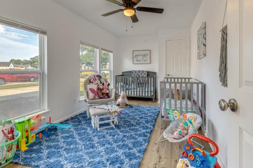a room with two cribs and a blue rug at Families Welcome! Recently Renovated Home in Katy in Katy