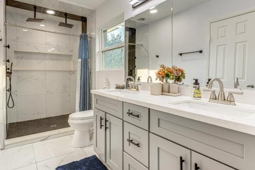 a bathroom with a sink and a toilet and a shower at Families Welcome! Recently Renovated Home in Katy in Katy