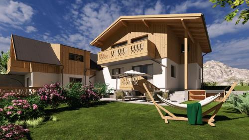a house with a hammock in front of it at Ferienhaus Korda in Ramsau am Dachstein