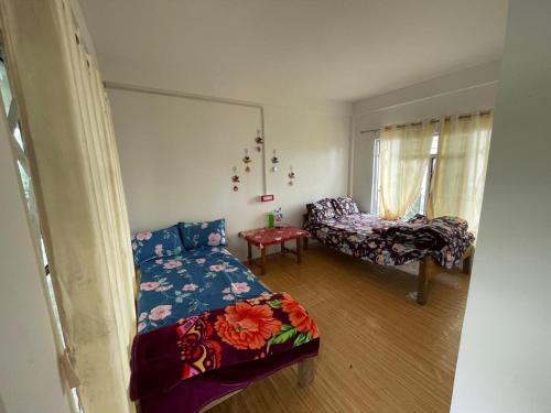 Ένα ή περισσότερα κρεβάτια σε δωμάτιο στο The Jhandi Nest