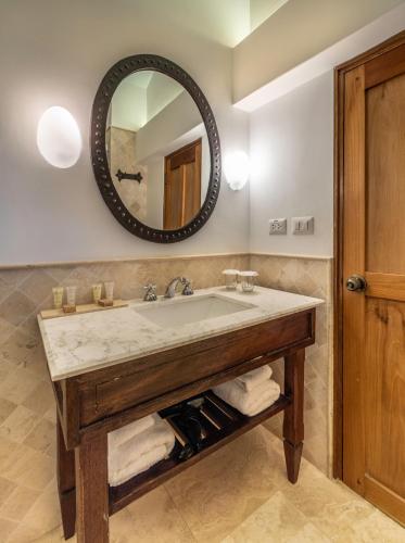 a bathroom with a sink and a mirror at Hotel La Casona De Yucay Valle Sagrado in Urubamba