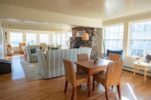 a dining room with a table and chairs at The Beach House Inn in Kennebunk