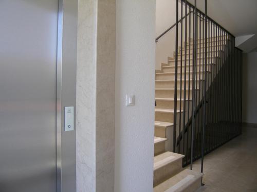 a staircase in a house with a metal railing at Apartments Mon Amour in Dubrovnik