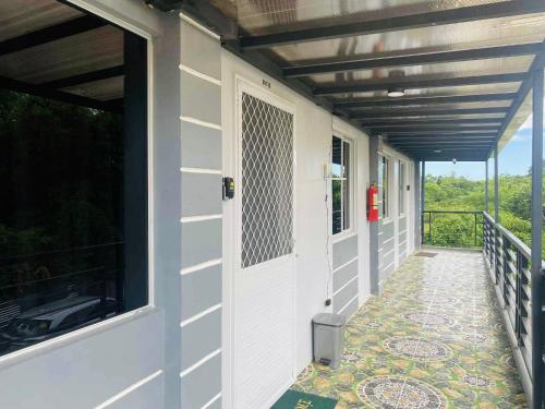 a walkway leading to the front door of a house at 2K2M Rental Units in Panglao