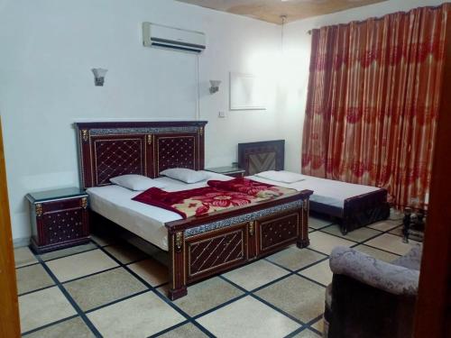 Ένα ή περισσότερα κρεβάτια σε δωμάτιο στο New moon soon hotel