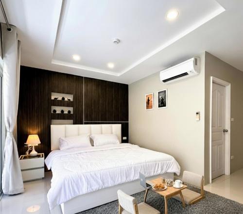 Postel nebo postele na pokoji v ubytování Pattaya plage studio moderne - New nordic sunset